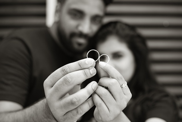 Couple holding wedding rings together - by Anil sharma from Pixabay